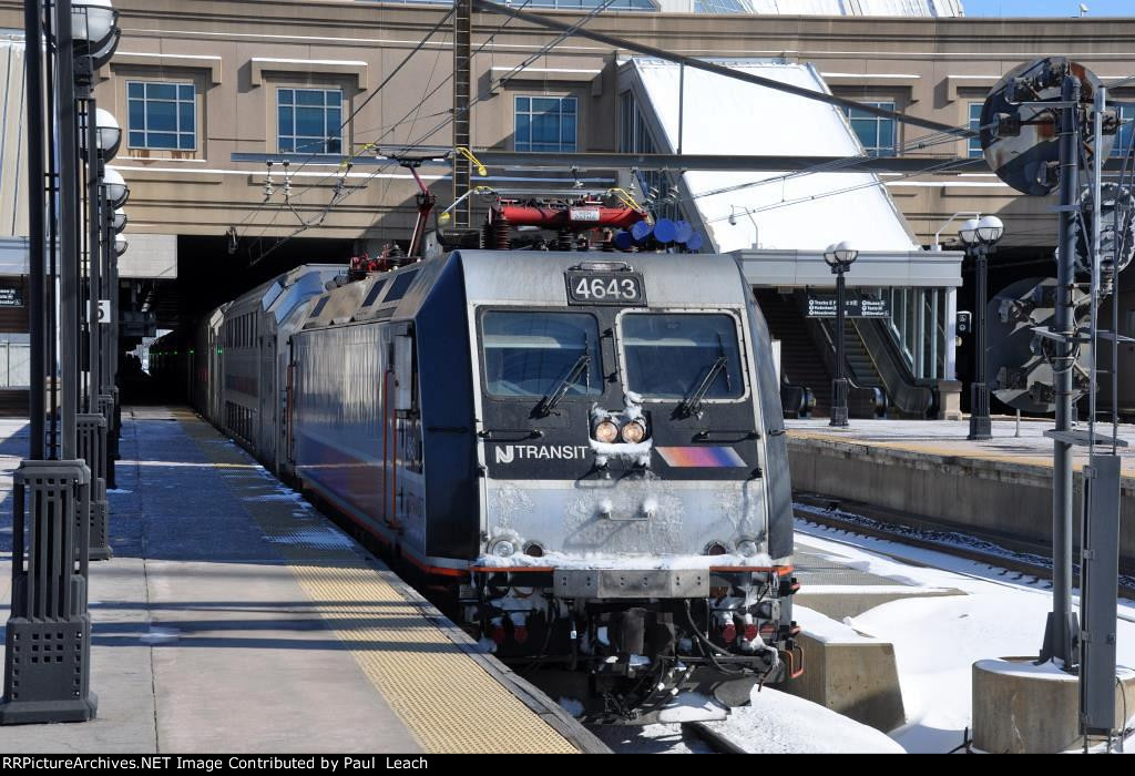 Westbound commuter comes out of the station